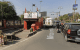 temple in the middle of a road in India Jaipur traffic flowing around shrine